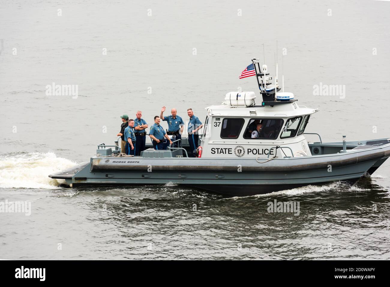 Boston, Massachusetts. 13th June, 2017. Mass State Police boat during Parade of Sail at Sail Boston. Photographed from the USS Whidbey Island. Stock Photo