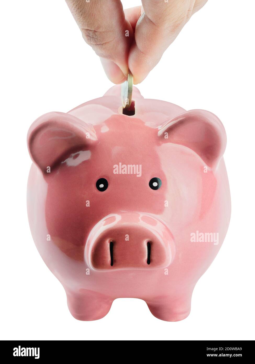 close up hand putting coin into piggy bank on white background Stock ...