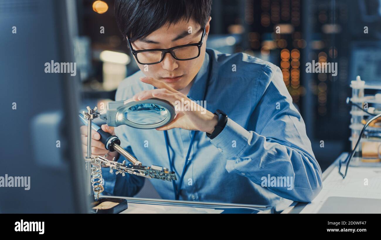 Close Up of a Professional Japanese Electronics Development Engineer in ...