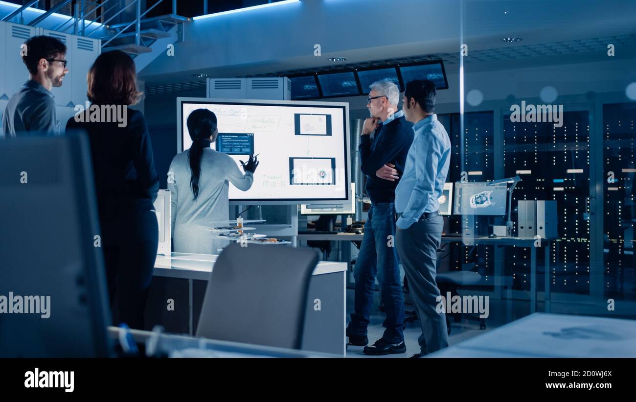 Engineers Meeting in Technology Research Laboratory Male Engineer Leads Presentation Using