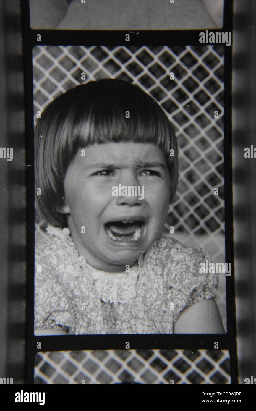 Fine 1970s vintage black and white photography of a little girl crying. Stock Photo