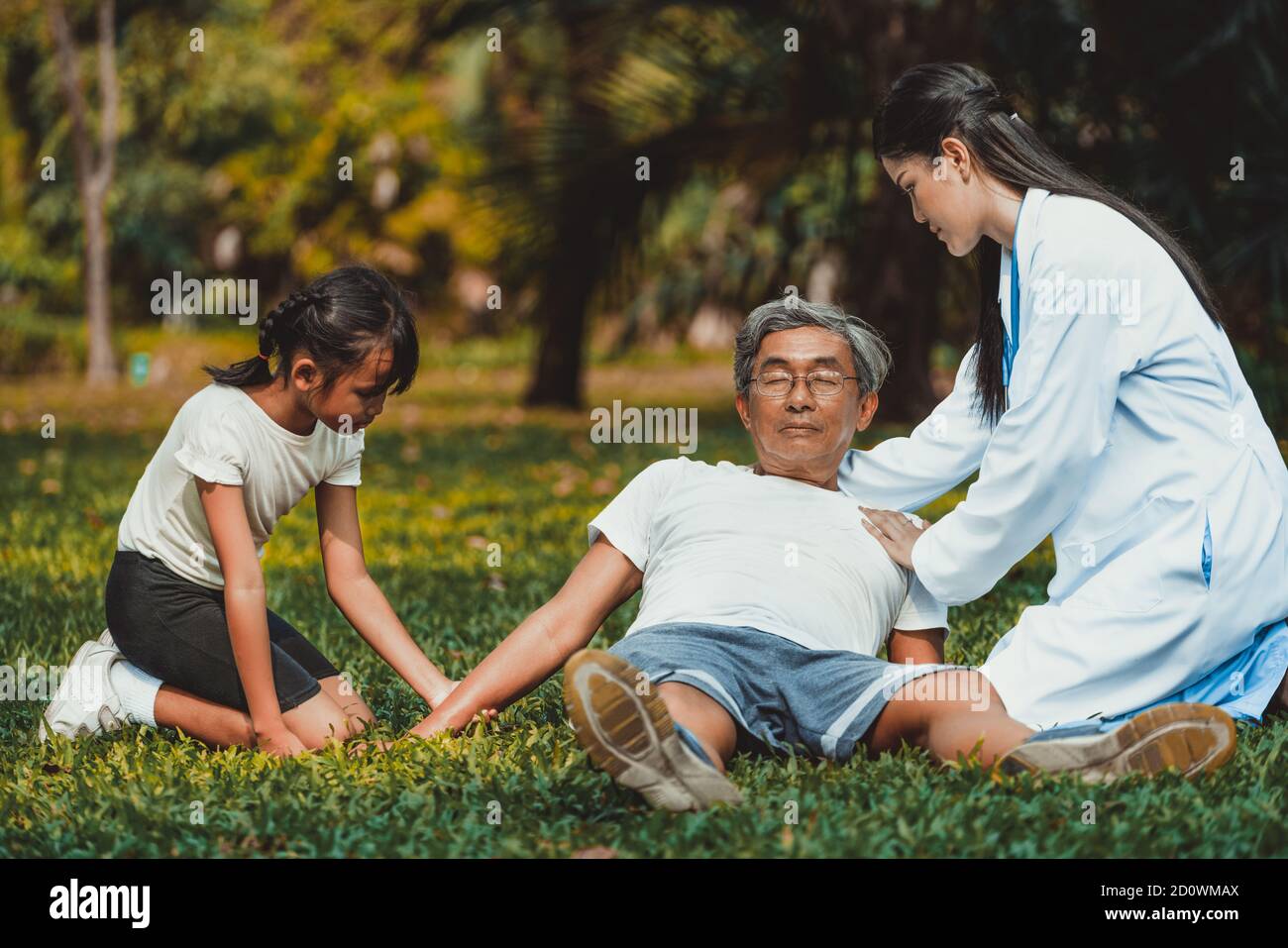 Senior man having chest pain or heart attack in the park. Old people elderly healthcare concept. Stock Photo