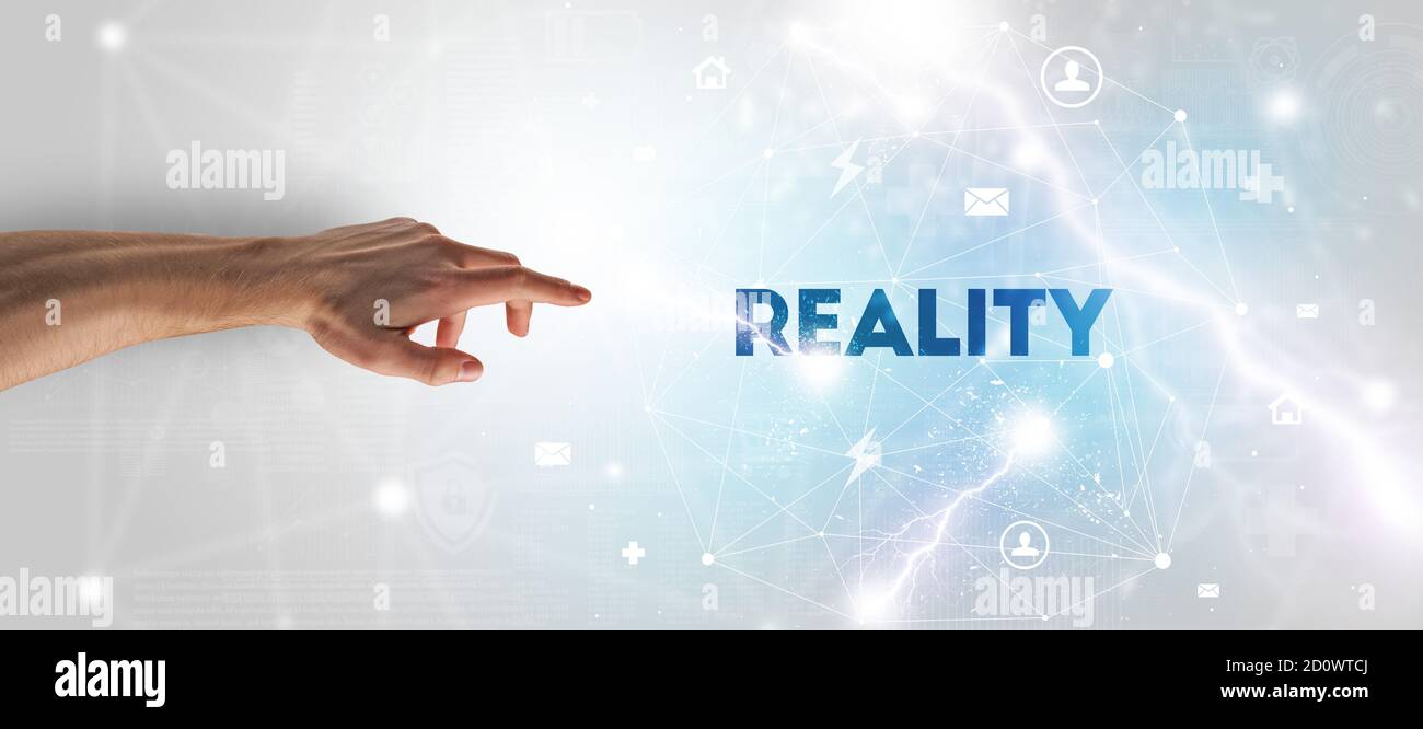 Hand pointing at REALITY inscription, modern technology concept Stock ...