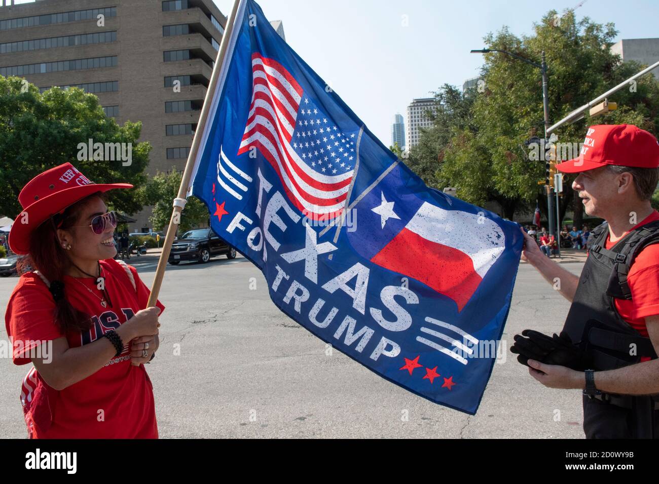 Austin, TX USA October 3, 2020: Trump Supporters cheer as the This is Texas Freedom Force (TITFF) stand guard outside the Texas Capitol during a 'Constitutional Rights Summit' where Texans were encouraged to speak out and stand up to 'tyranny and government over reach' and the right to carry guns. Credit: Bob Daemmrich/Alamy Live News Stock Photo