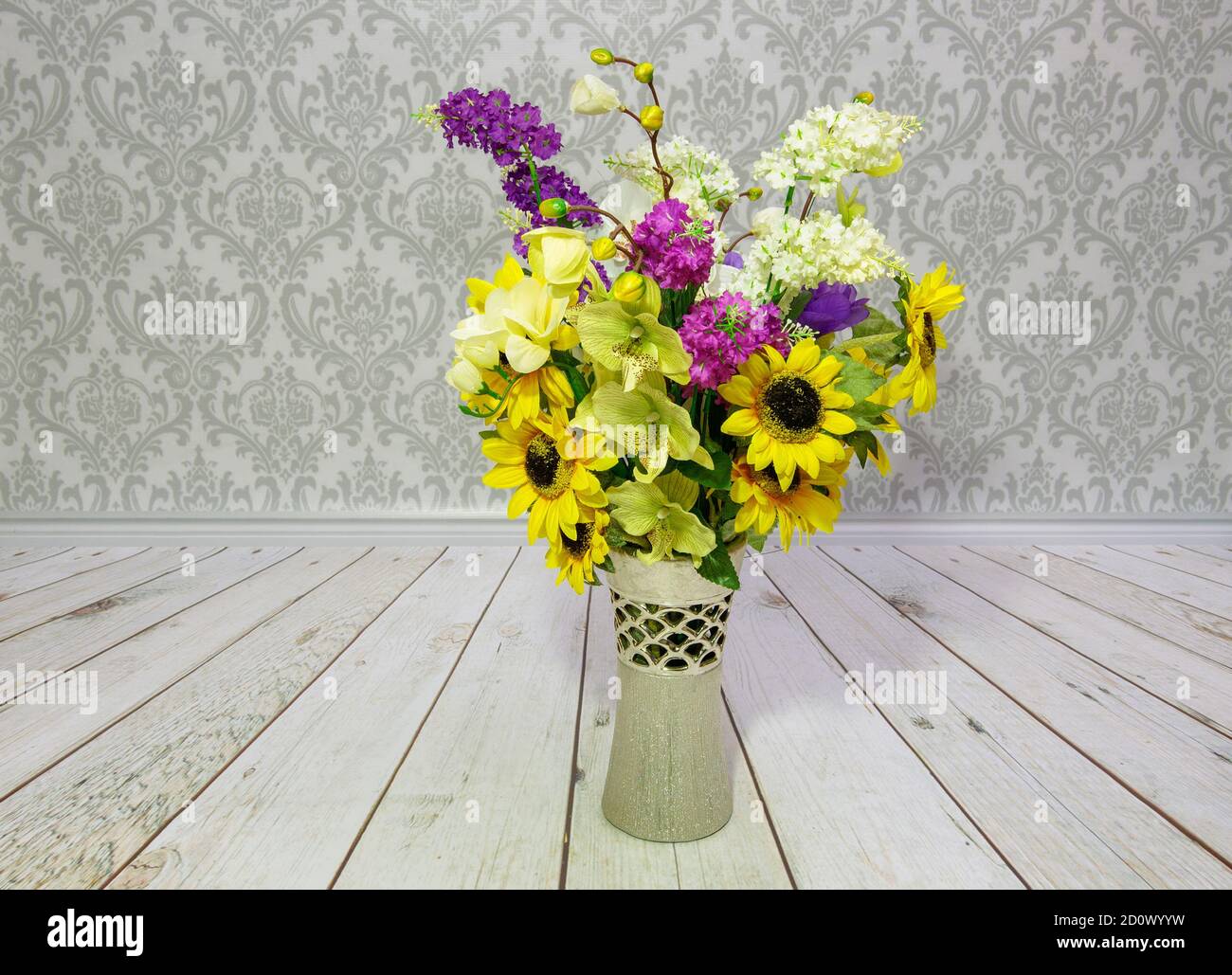 colors artificial flowers in a decorative vase on the floor and wall