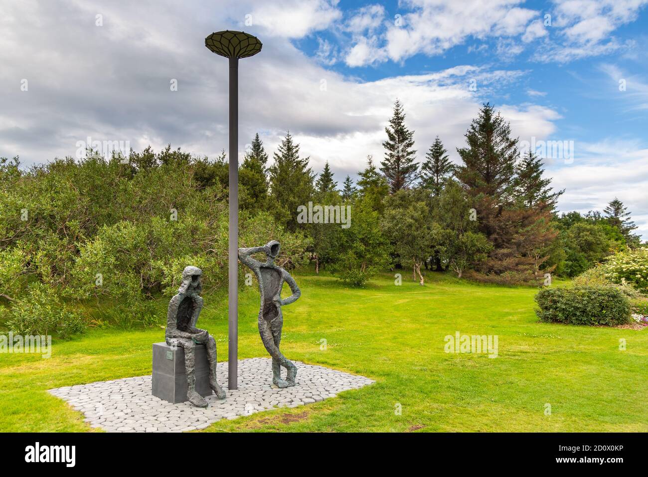 Reykjavik,Iceland- 27 August 2015: Boy and Girl, Monument at Midborg on Lake Tjornin in the city center. Stock Photo