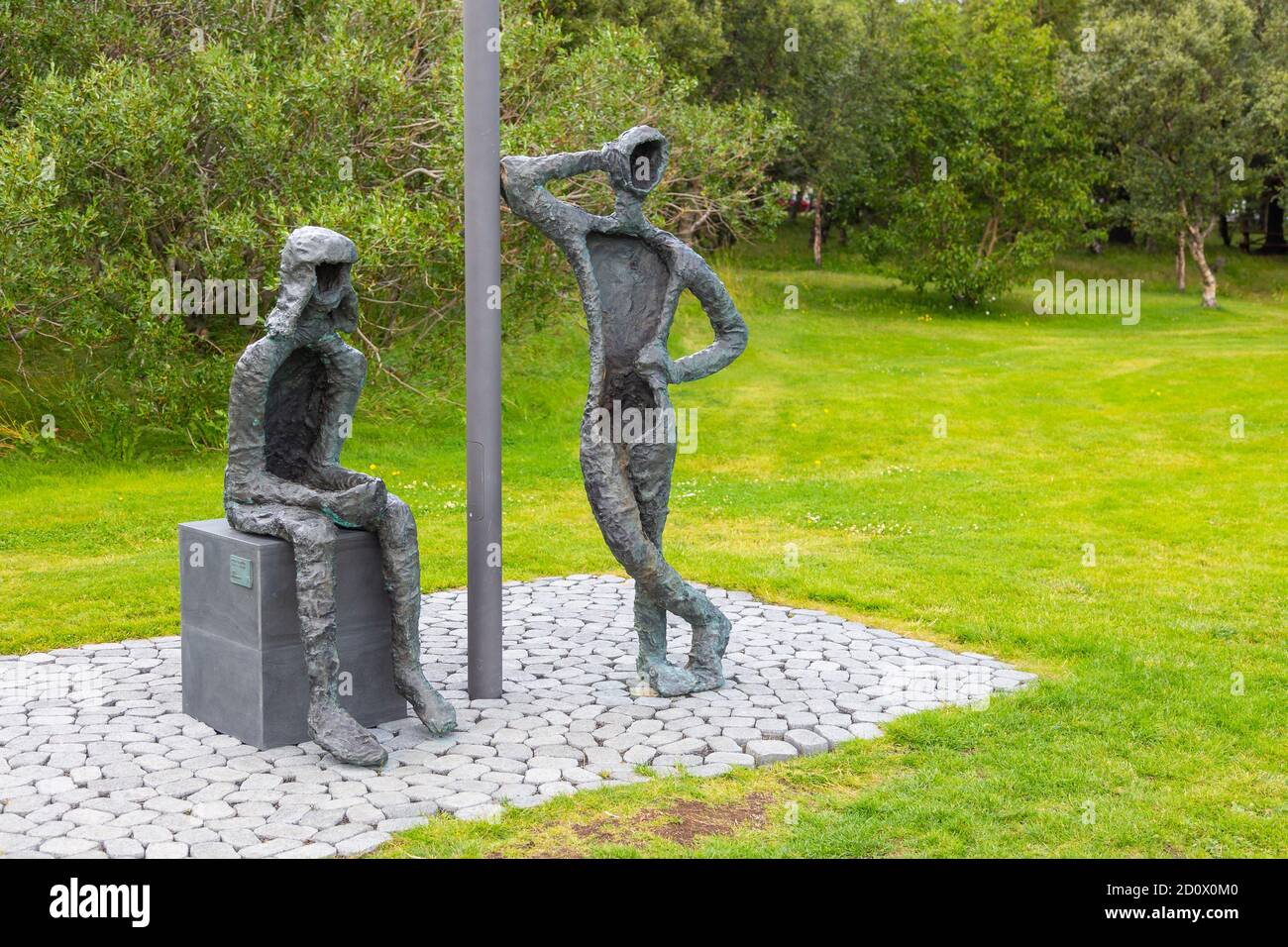 Reykjavik,Iceland- 27 August 2015: Boy and Girl, Monument at Midborg on Lake Tjornin in the city center. Stock Photo