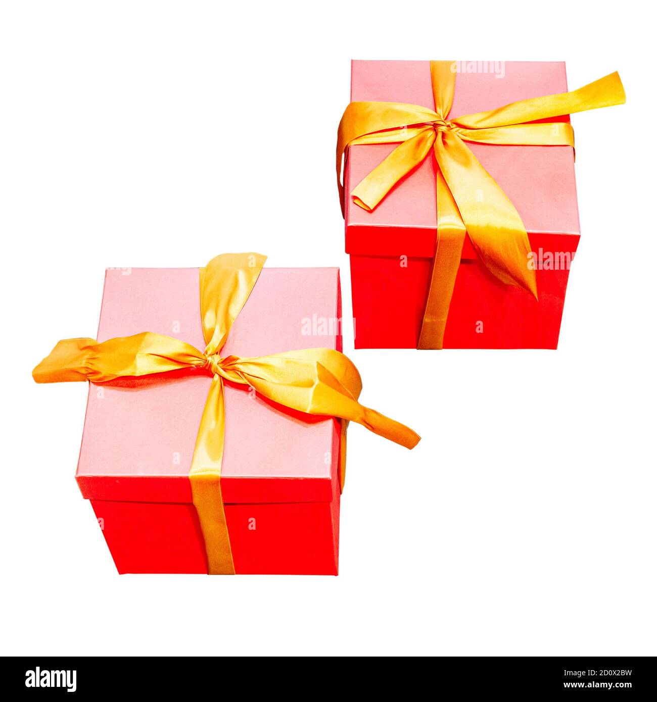Two identical red gift boxes with gold ribbons on isolated background ...