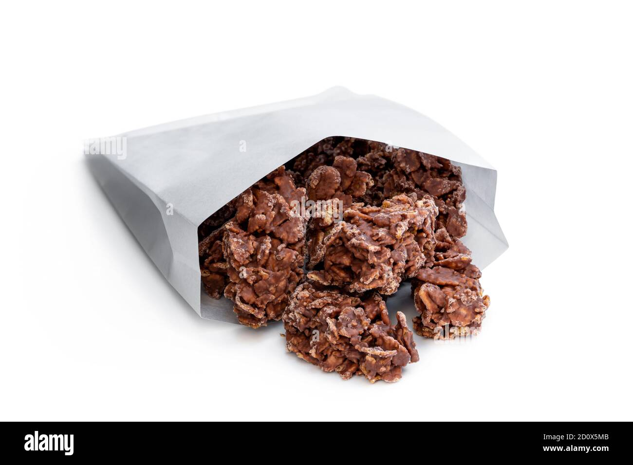 Chocolate  corn flake clusters in paper bag isolated on white Stock Photo