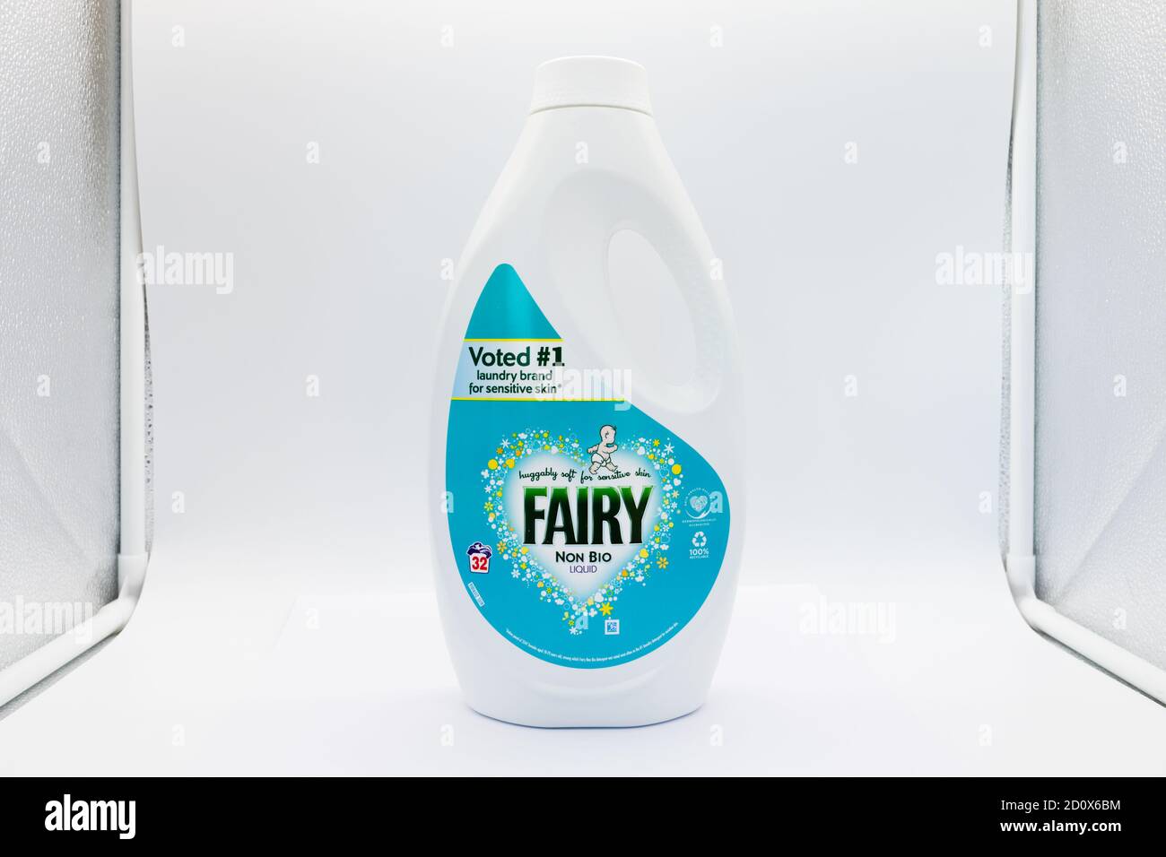 Irvine, Scotland, UK - October 01, 2020: Fairy branded non-bio washing machine liquid in recyclable plastic bottle and top displaying various symbols Stock Photo