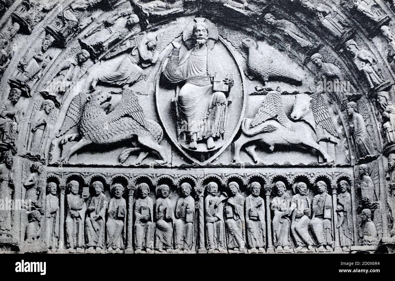 A historical view of the central tympanum above the Royal Portal of Chartres Cathedral showing Christ seated on a throne, Chartres, Centre-Val de Loire, France, taken from a postcard c.early 1900s. Stock Photo
