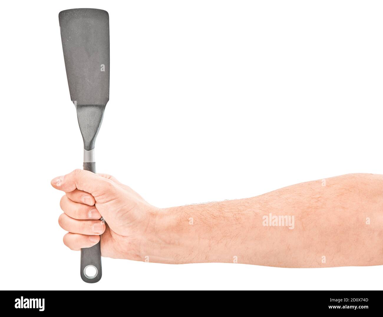 Male hands holding a spatula for frying. Isolated on gray background