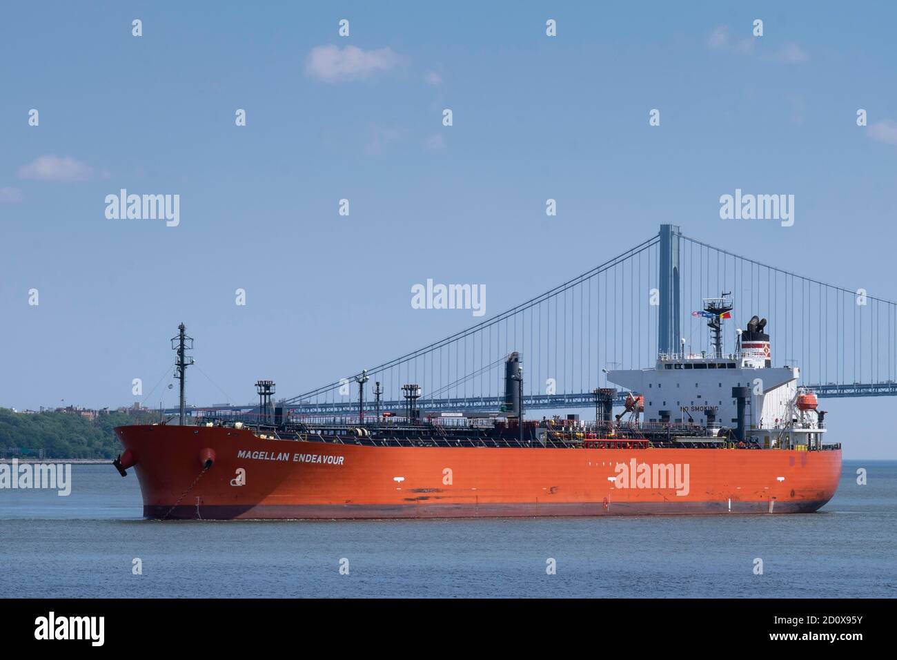 Chemical Oil tanker Magellan Endeavor sails at the Manhattan Bridge structure in New York over