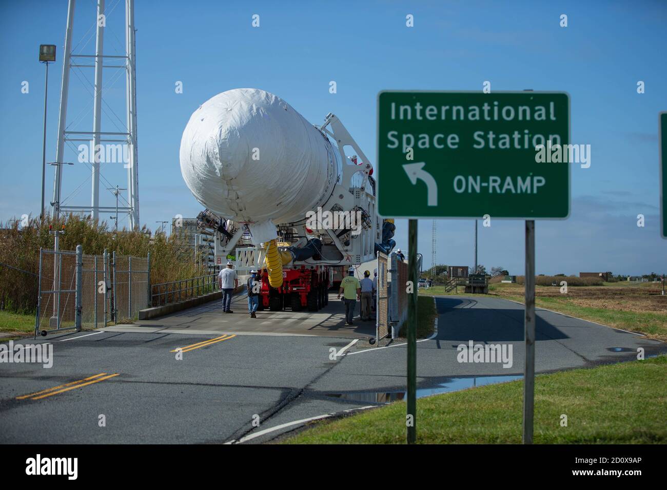 The Northrop Grumman Antares rocket, with Cygnus resupply spacecraft onboard, is rolled out of the Horizontal Integration Facility on its way to the Mid-Atlantic Regional Spaceport Launch Pad-0A at the NASA Wallops Flight Facility September 26, 2020 in Wallops, Virginia. The commercial cargo resupply mission is carrying 8,000 pounds of supplies and equipment to the International Space Station. Stock Photo