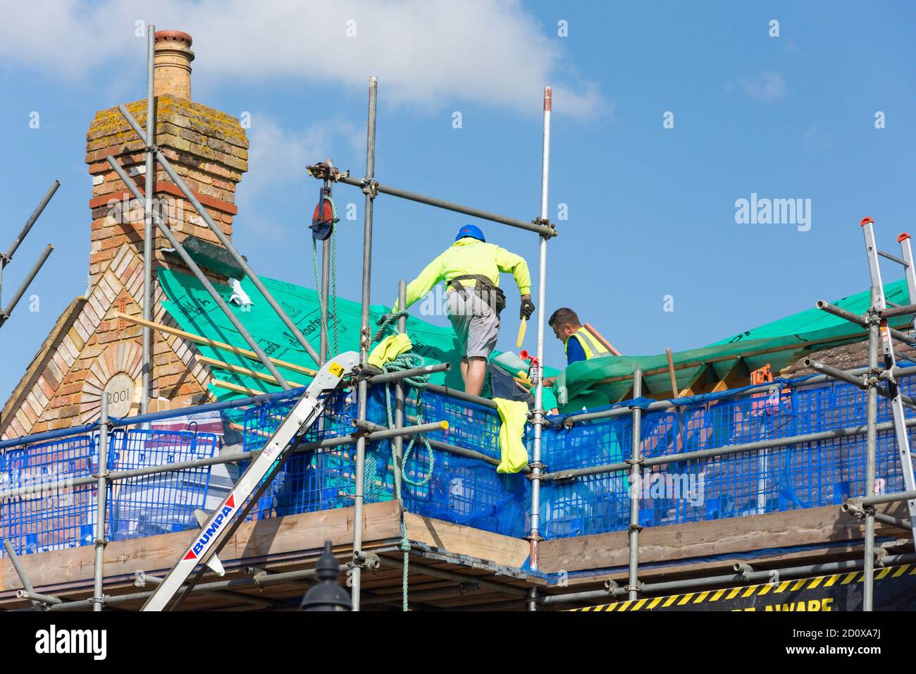 Re-roofing works under the Heathrow Protection Scheme, Stanwell Moor, Surrey, England, United Kingdom Stock Photo