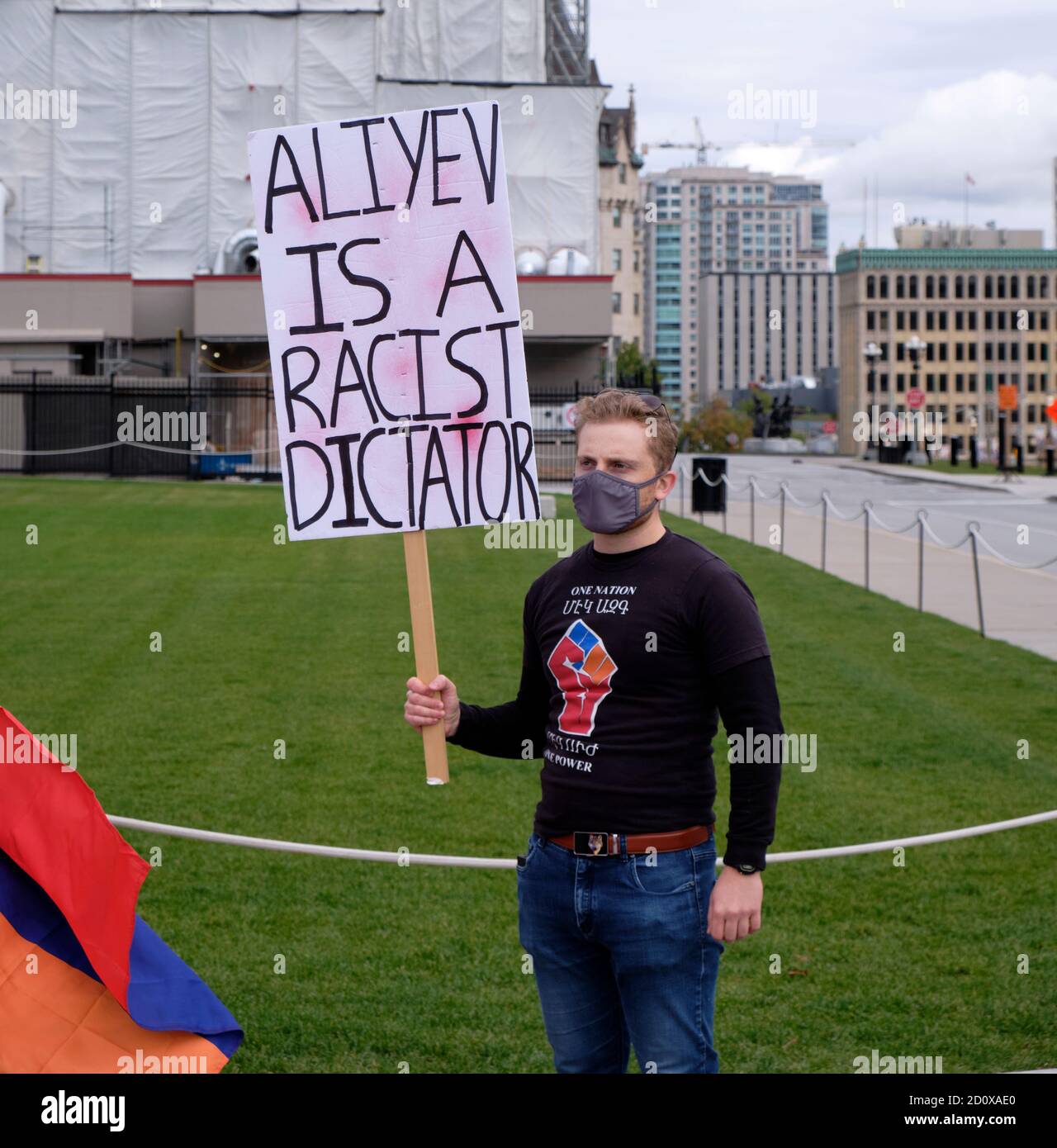 Armenian lead Protest to stop the Azeri aggression on Artzakh in front of Canadian Parliament. Protester with sign 'Aliyev is a racist dictator' Stock Photo
