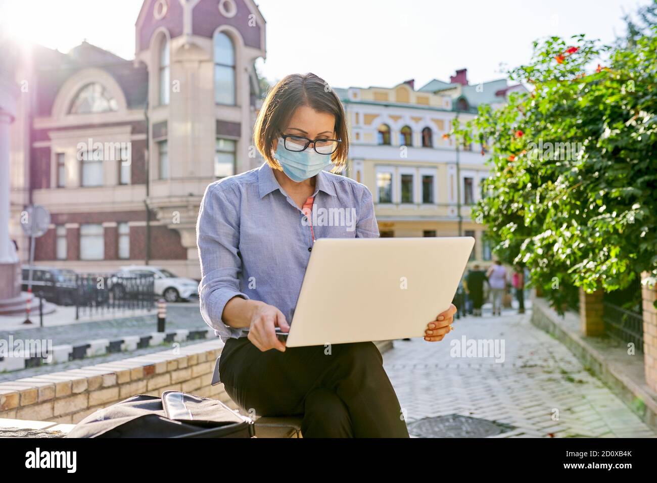 Mature woman using a face mask hi-res stock photography and images - Alamy