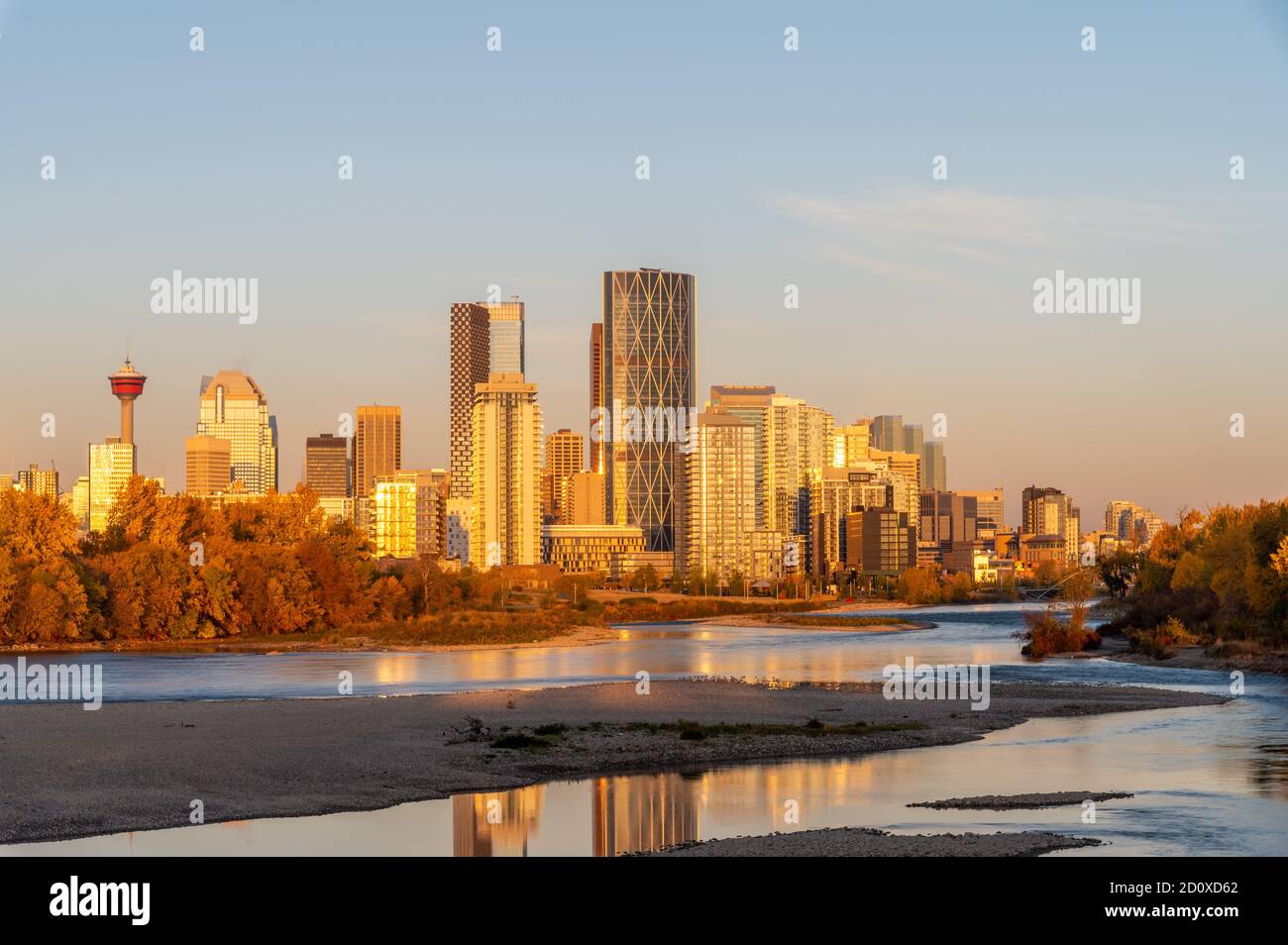 Calgary's skyline along the Bow River in autumn during a nice sunrise ...