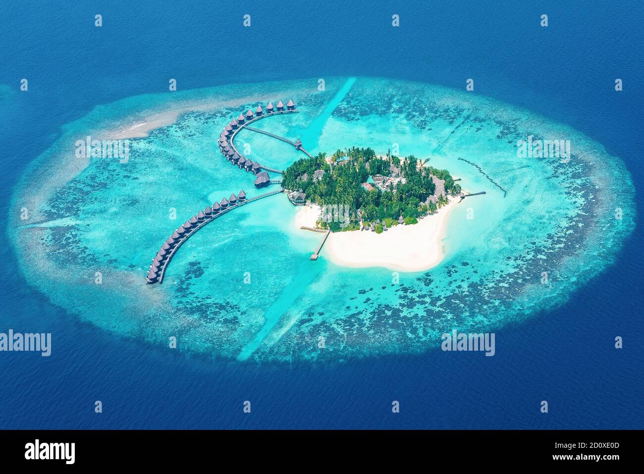 Just prior to landing at Male airport in the Maldives many small coral islands can be viewed from the plane windows. Stock Photo