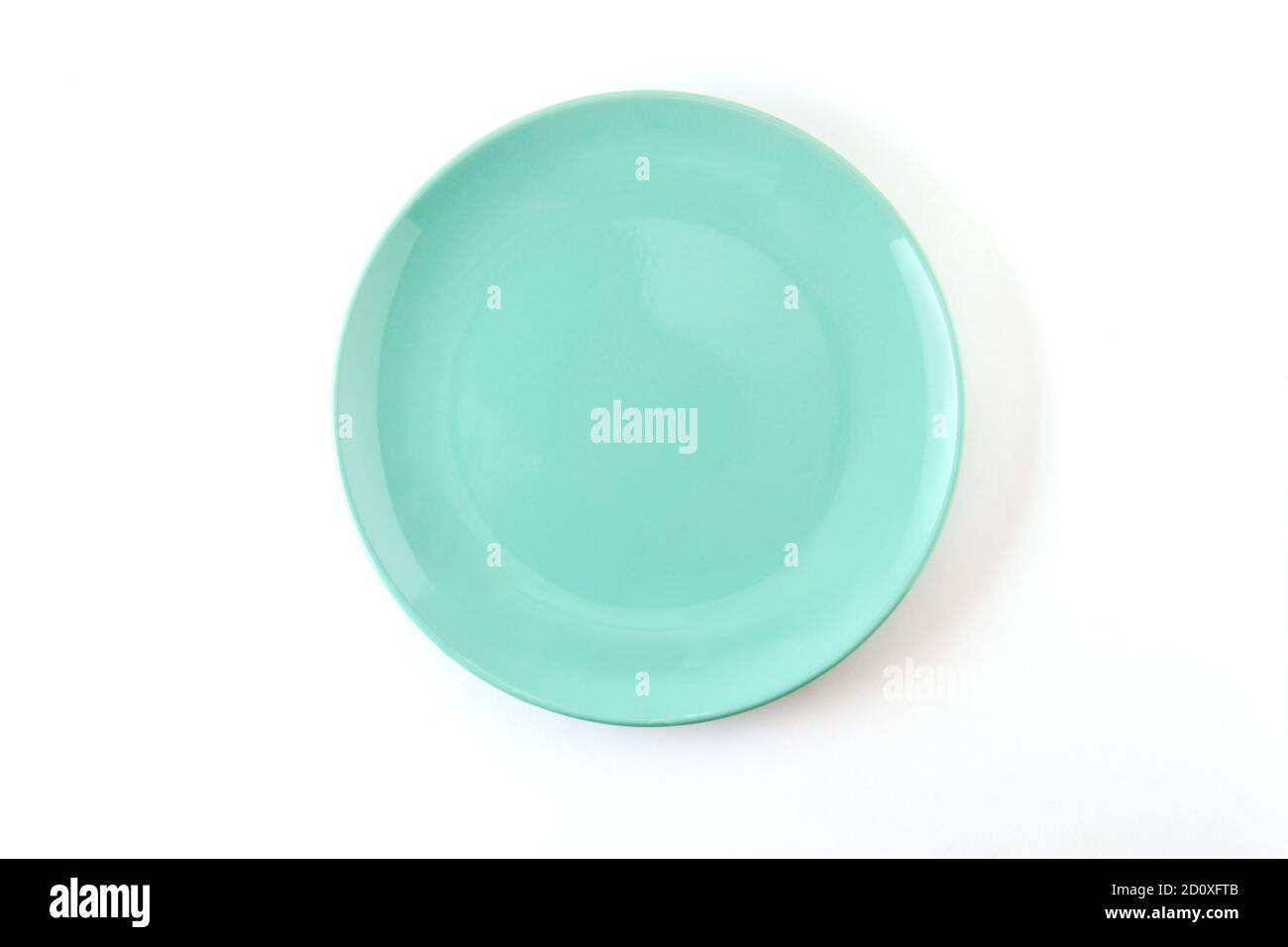 Pure isolated plate of pastel turquoise color on a white background