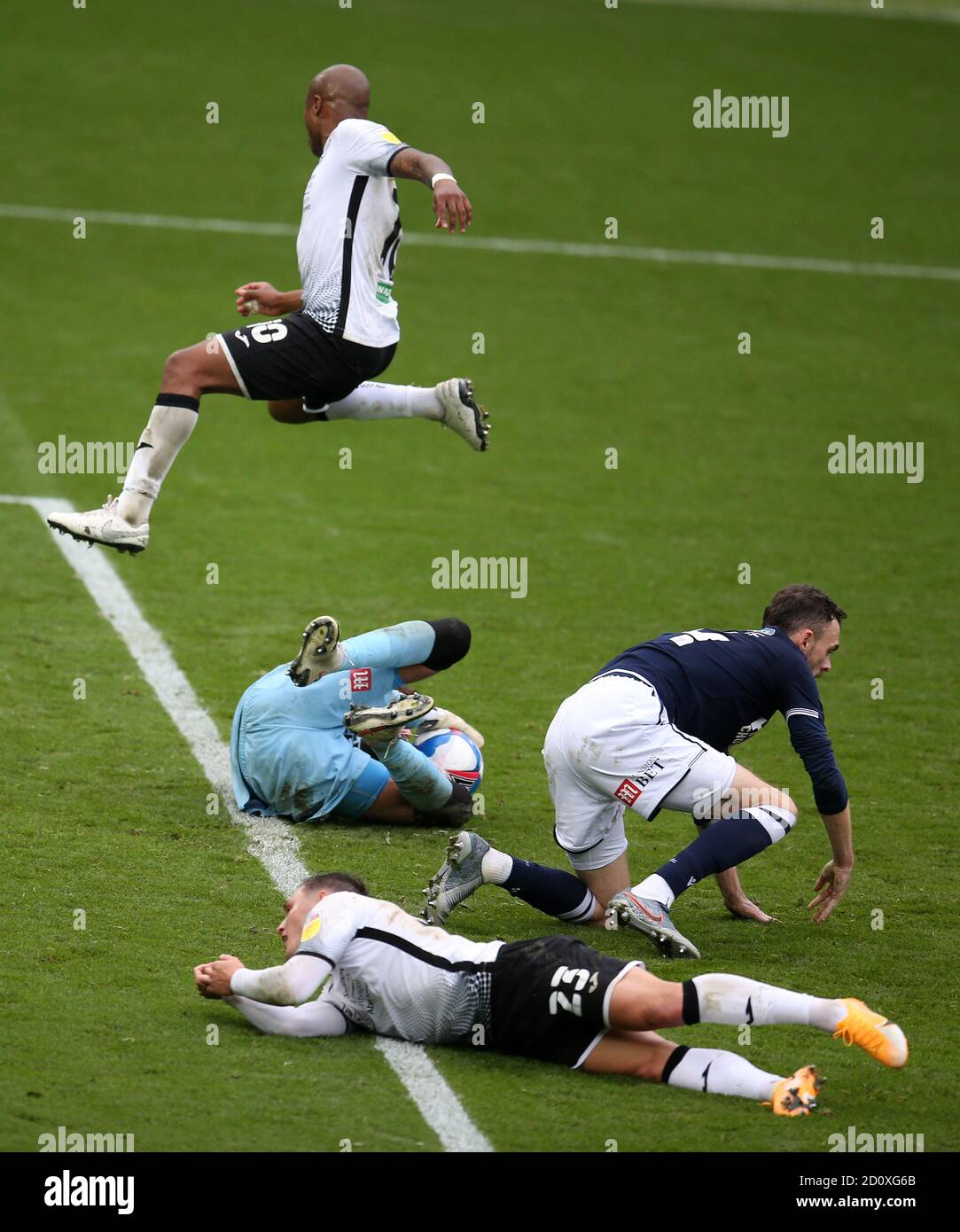 Swansea, UK. 03rd Oct, 2020. Bartosz Bialkowski, the goalkeeper of Millwall (c) claims the ball to deny Connor Roberts (23) and Andre Ayew of Swansea city (10).EFL Skybet championship match, Swansea city v Millwall at the Liberty Stadium in Swansea on Saturday 3rd October 2020. this image may only be used for Editorial purposes. Editorial use only, license required for commercial use. No use in betting, games or a single club/league/player publications. pic by Andrew Orchard/Andrew Orchard sports photography/Alamy Live news Credit: Andrew Orchard sports photography/Alamy Live News Stock Photo