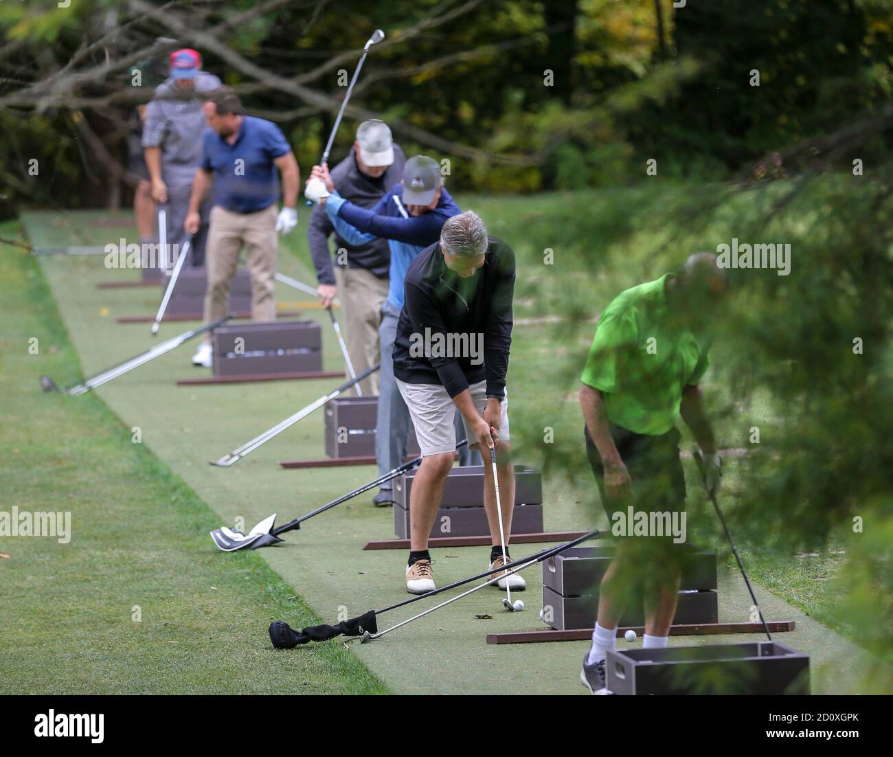 Golfers practicing at a driving range Stock Photo Alamy
