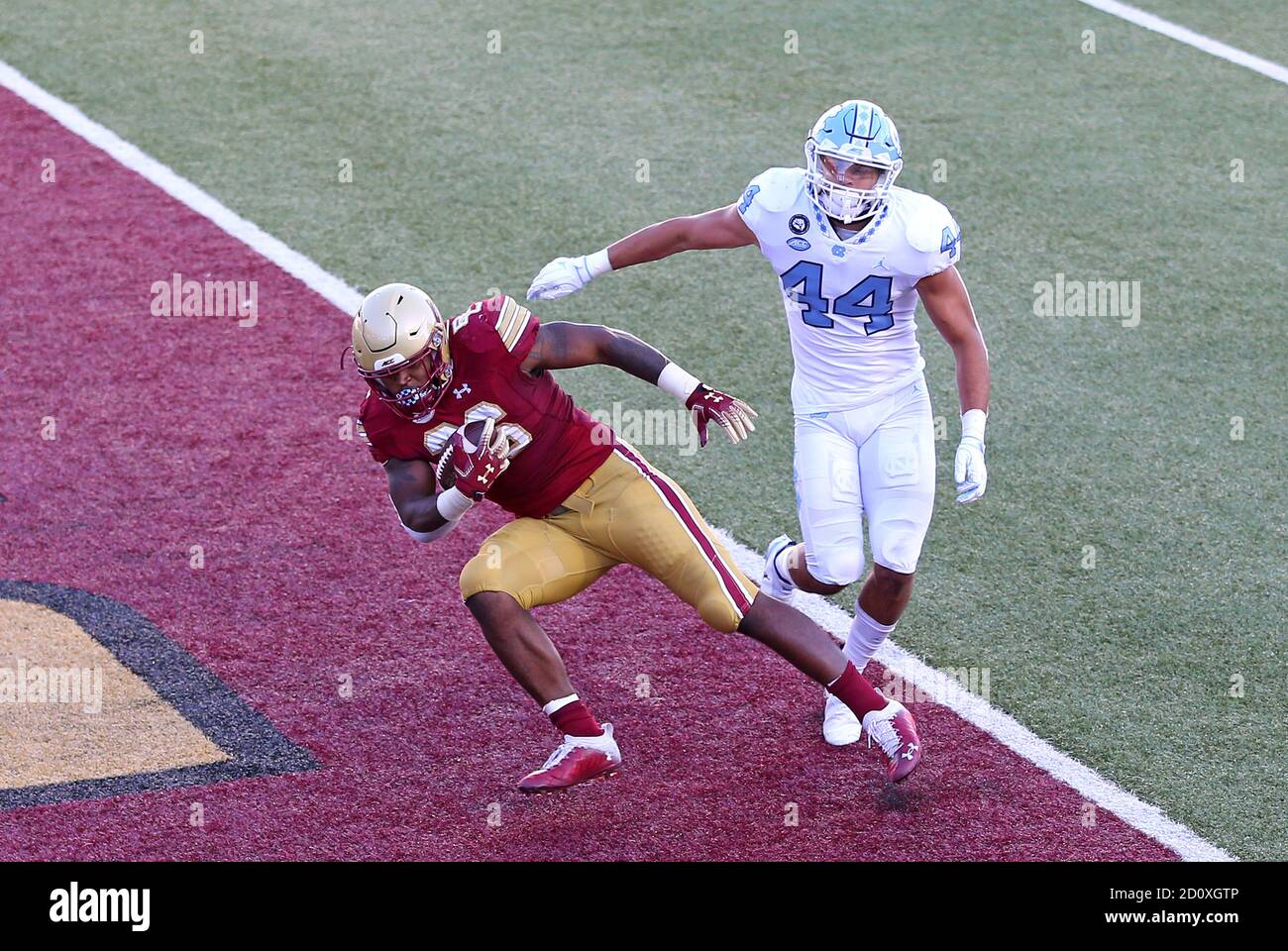 Alumni Stadium. 3rd Oct, 2020. MA, USA; Boston College Eagles running back David Bailey (26) catches a touchdown pass while defended by North Carolina Tar Heels linebacker Jeremiah Gemmel (44) during the NCAA football game between North Carolina Tar Heels and Boston College Eagles at Alumni Stadium. Anthony Nesmith/CSM/Alamy Live News Stock Photo
