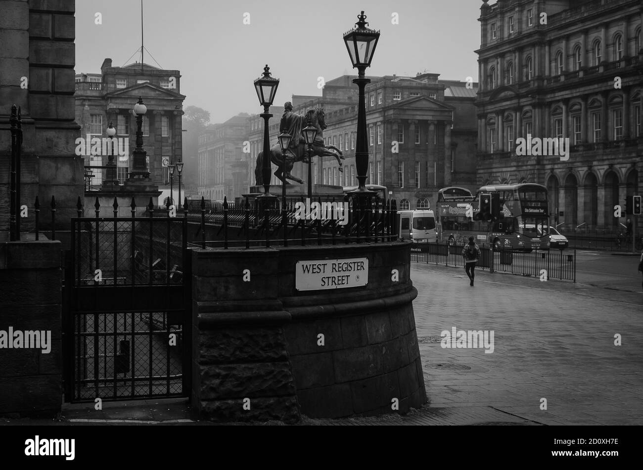 Street of Edinburgh city with the Iron Duke sculpture in the background on a foggy day, Edinburgh, Scotland Stock Photo