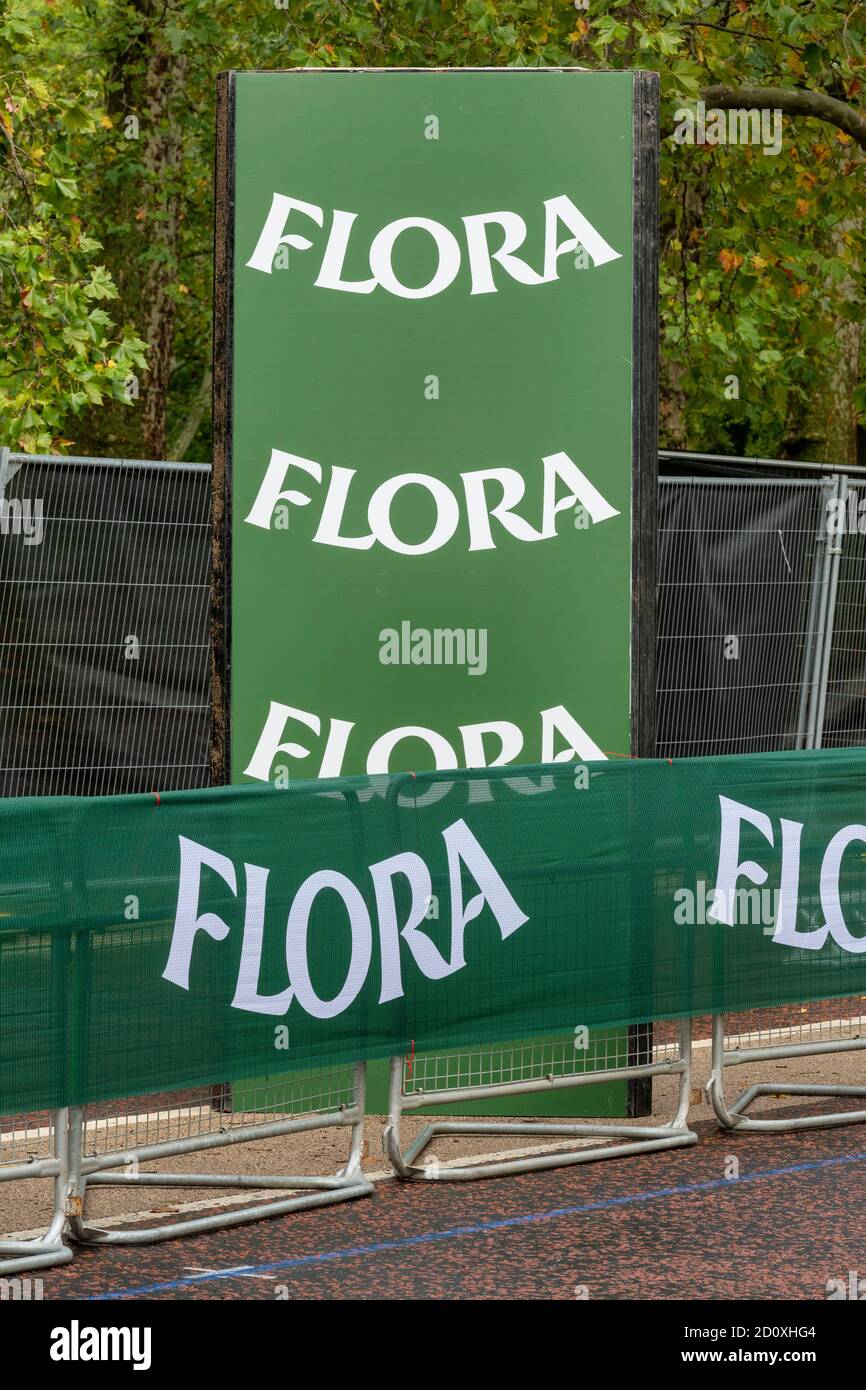 Floa sponsor board and banners along the route of the 40th London Marathon.Only Elite runners will run the course this year with everyone else taking part in a ‘virtual’ marathon. The race will take place on a closed Bio-secure loop circuit around St James’s Park in central London in The Mall, Birdcage Walk & Horse Guards parade. Stock Photo
