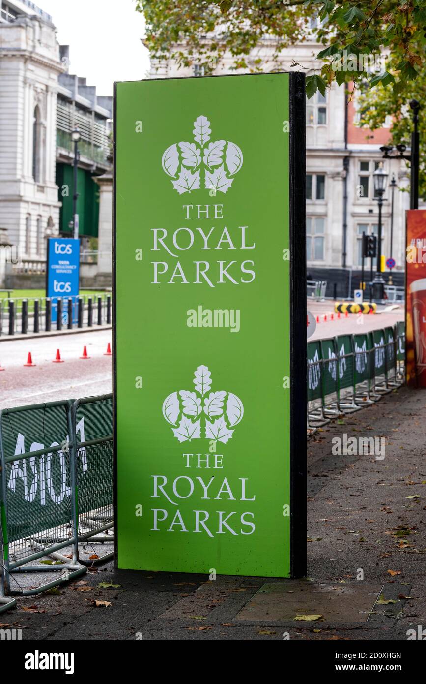 A Royal Parks sponsorship sign seen along the route of the 40th London Marathon.Only Elite runners will run the course this year with everyone else taking part in a ‘virtual’ marathon. The race will take place on a closed Bio-secure loop circuit around St James’s Park in central London in The Mall, Birdcage Walk & Horse Guards parade. Stock Photo