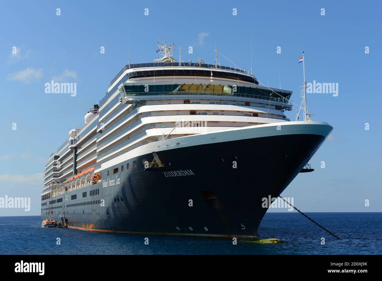 Holland American Line Cruise ship Zuiderdam is anchored offshore in