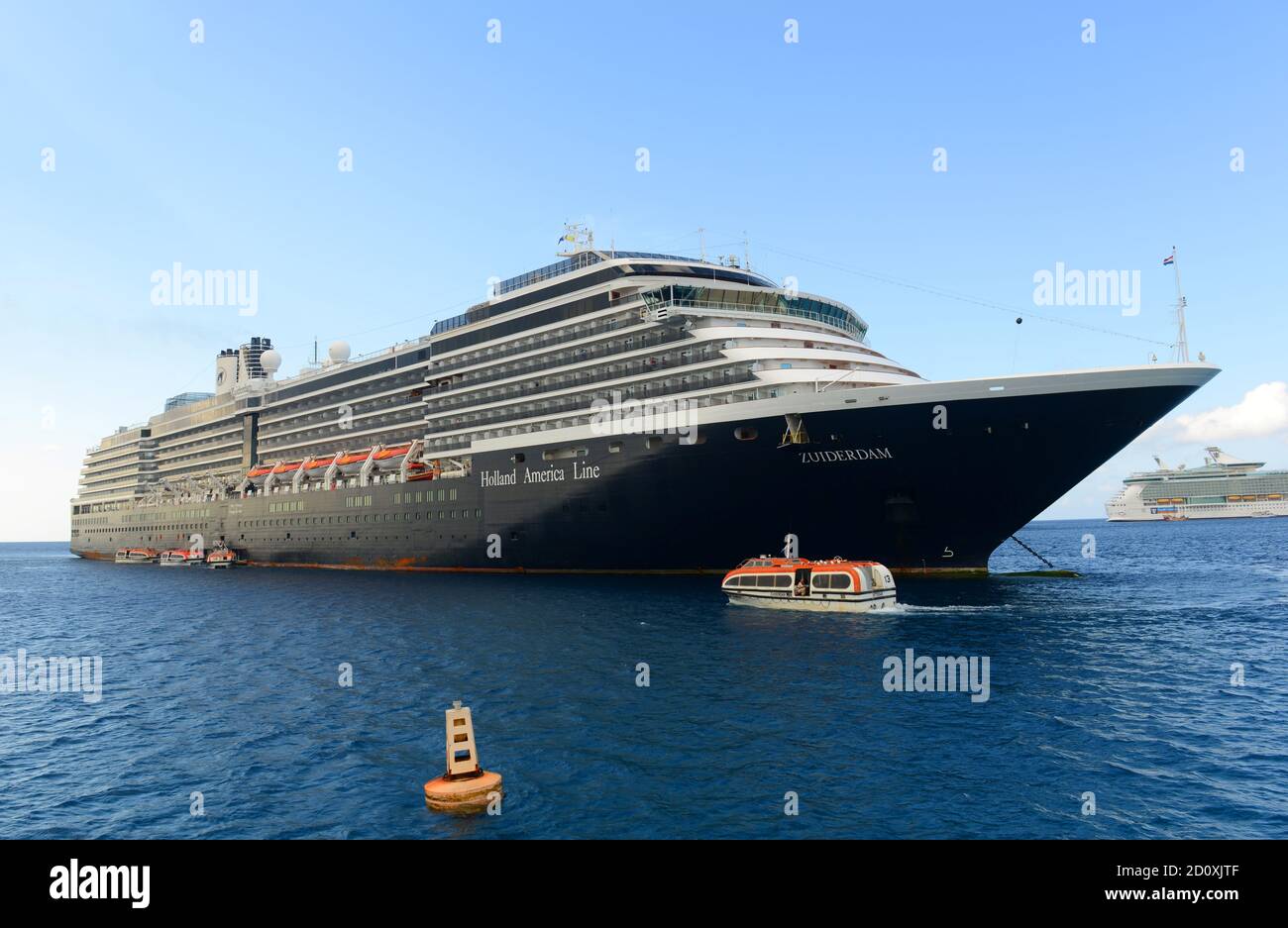 Holland American Line Cruise ship Zuiderdam is anchored offshore in George Town, Cayman Islands. Stock Photo