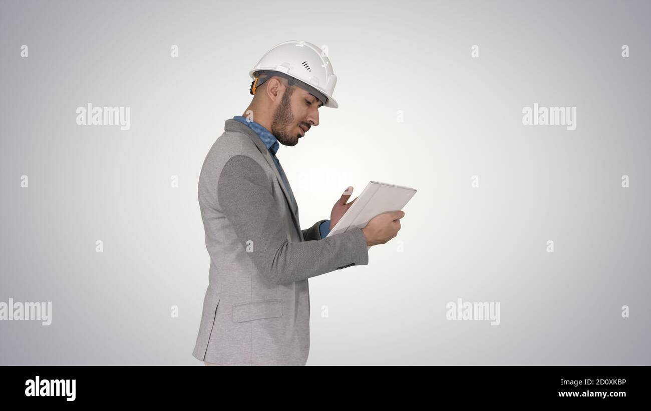 The hipster engineer making video call with tablet showing resul Stock Photo