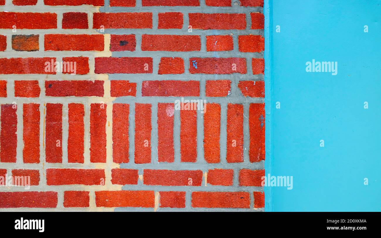 Red Brick Wall and Bright Blue Door Stock Photo