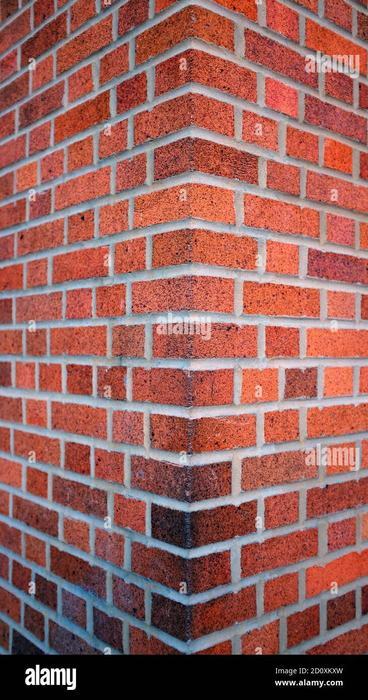 Corner of Bright Red Brick Building (Vertical) Stock Photo