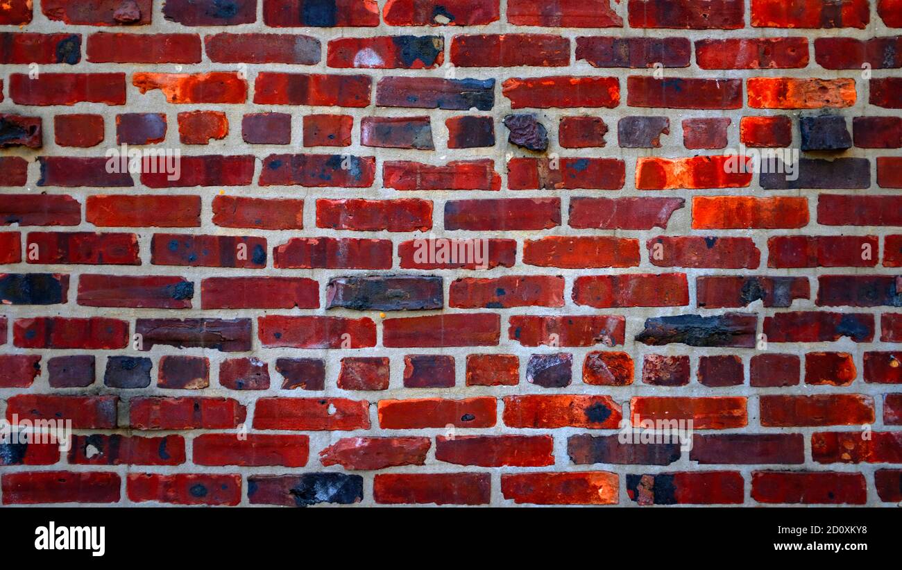 Grungy red and black brick wall Stock Photo