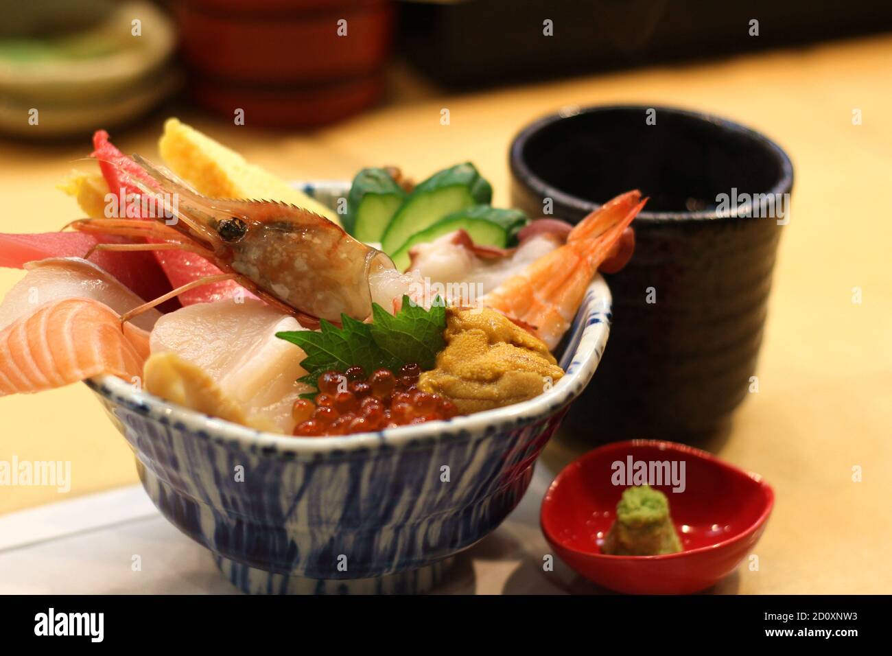 Close up of a bowl of delicious sashimi rice (raw seafood), Japanese cuisine, Aomori, Japan, Soft Focus Stock Photo