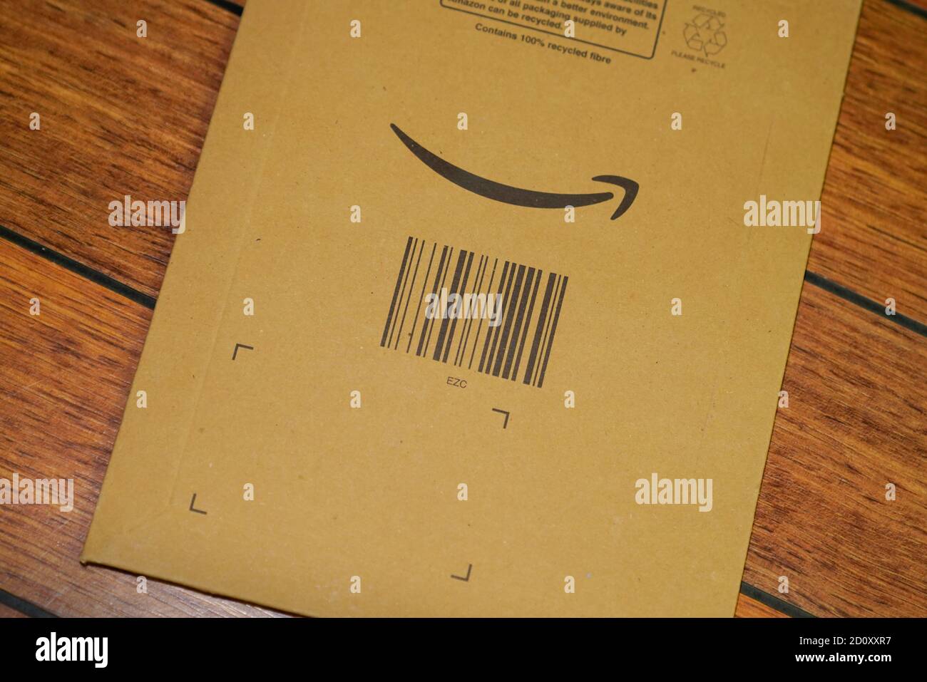 Bordeaux , Aquitaine / France - 09 25 2020 : Amazon logo with sign arrow smiling printed on envelope brown cardboard Stock Photo