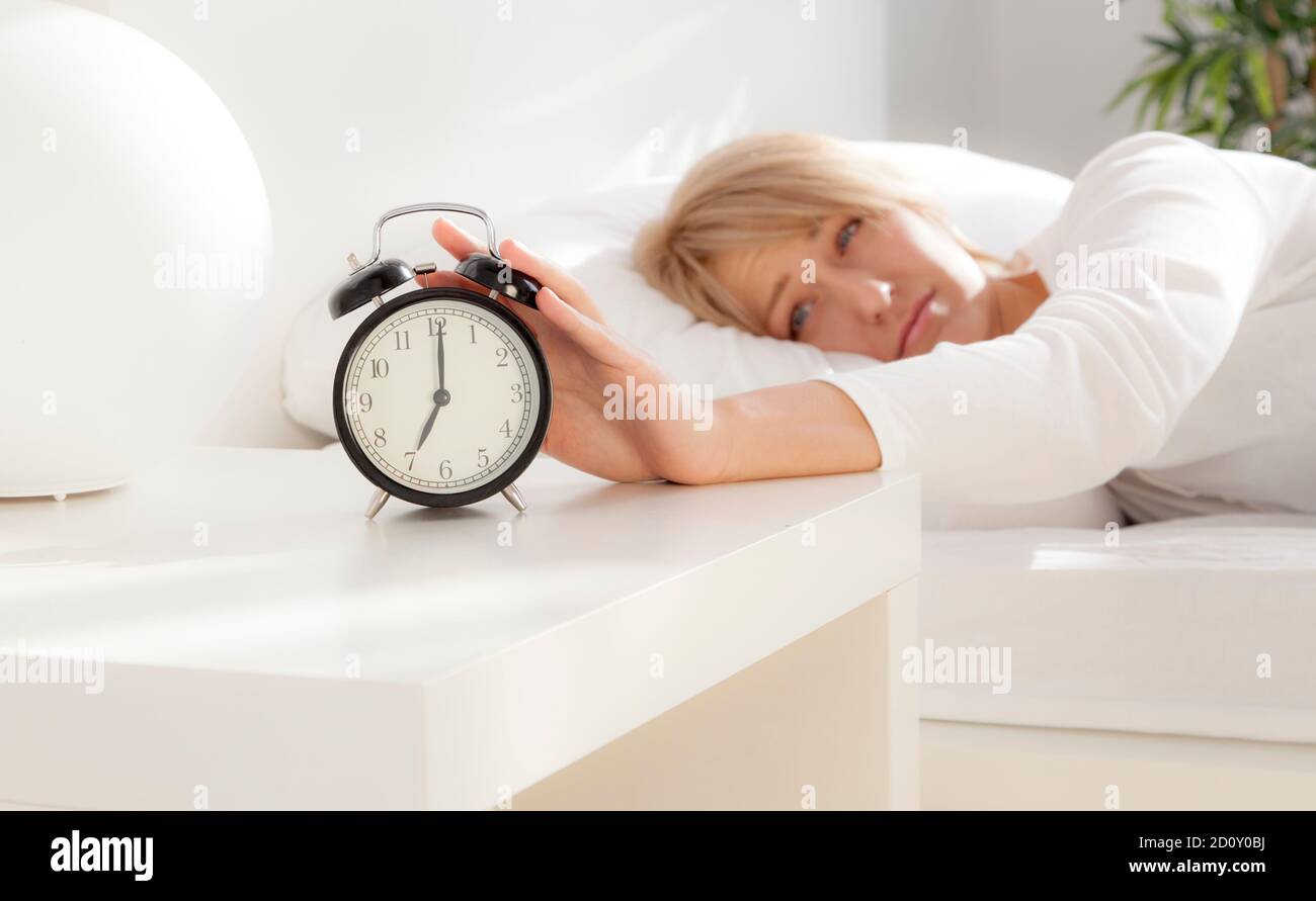 Lady Has Woken Up By An Alarm Clock Eyes Open Stock Photo Alamy