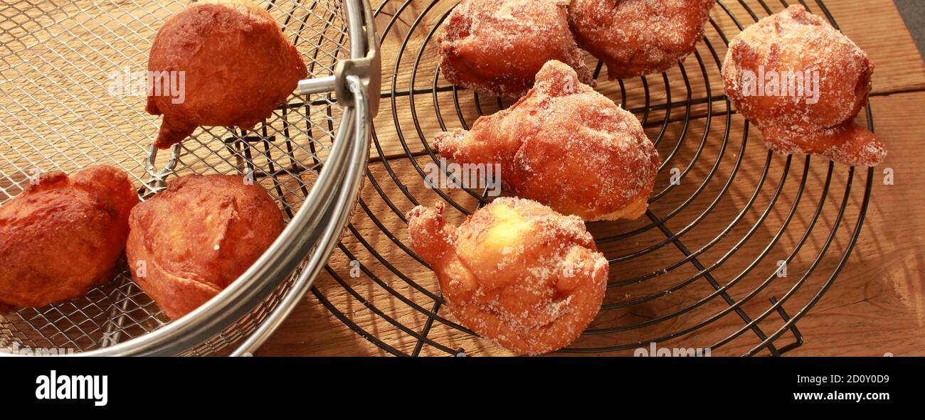 fresh donuts deepfried in the deep fryer Stock Photo Alamy