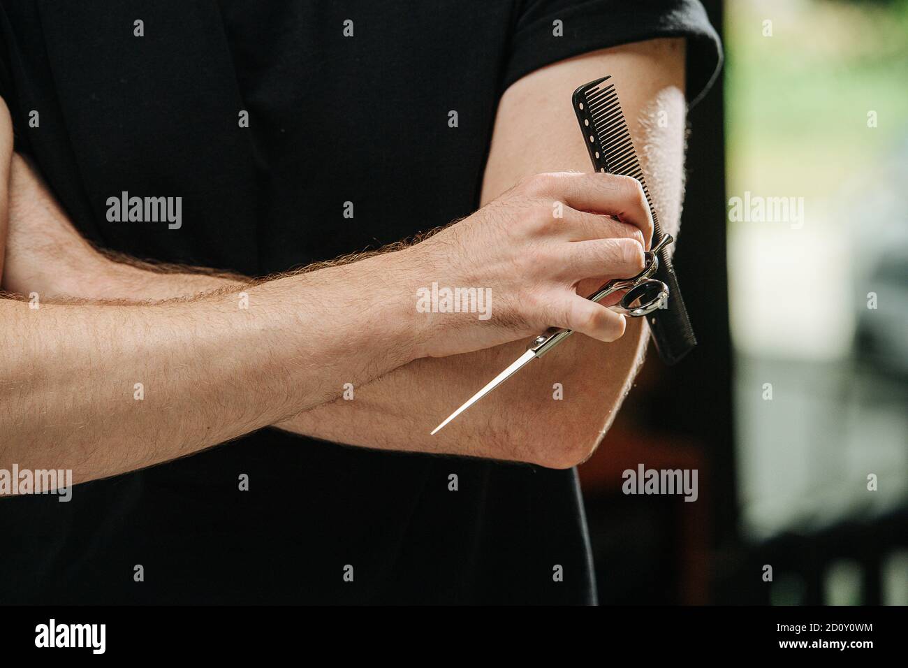 Crossed hands of a male hairdresser close up Stock Photo Alamy