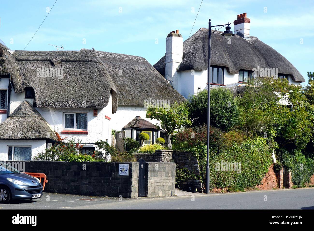 Paignton, Devon, UK. September 18, 2020. Two beautiful white and thatched cottages on the harbor at Paignton in Devon, UK. Stock Photo