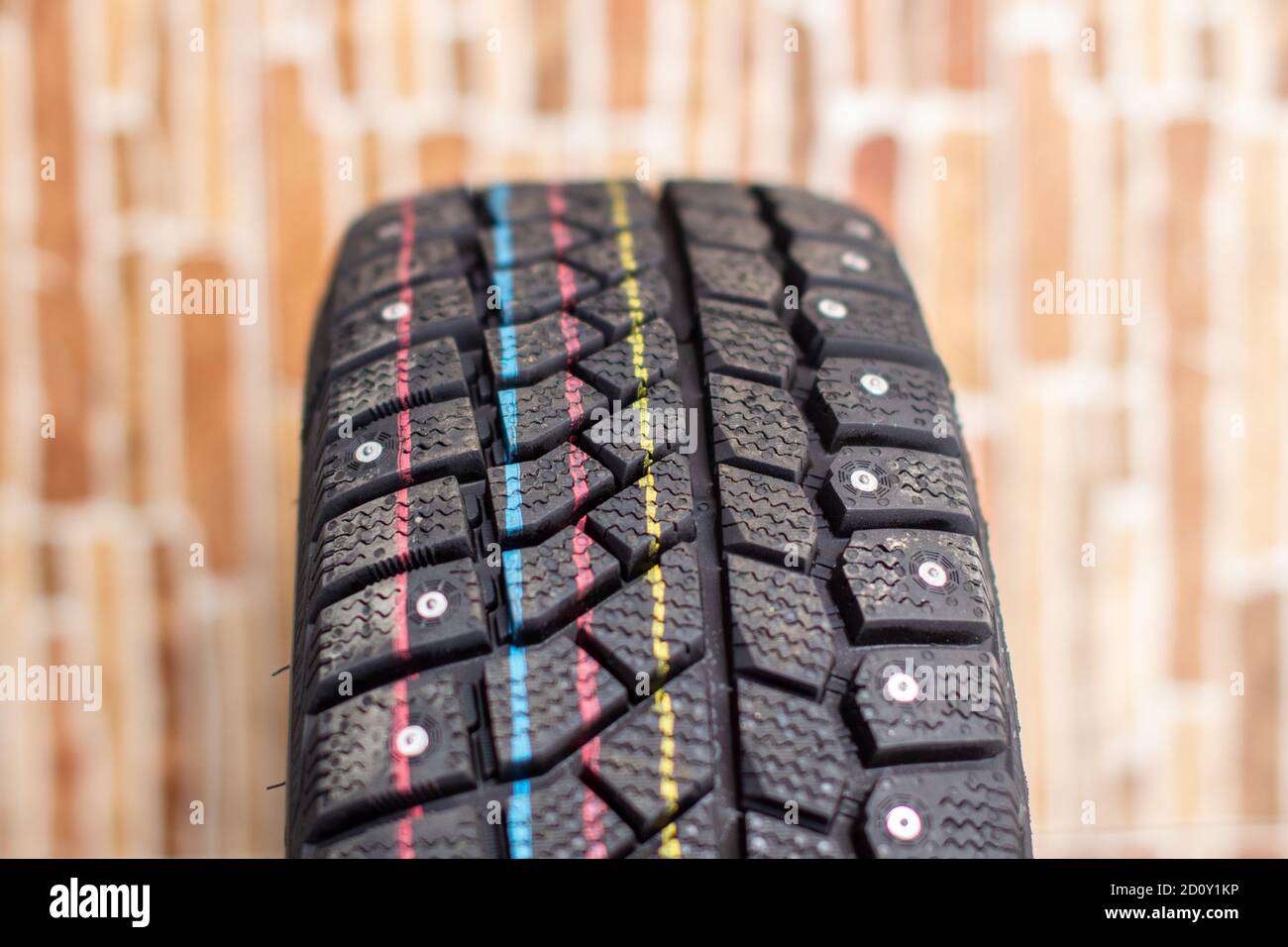 New, black winter car tires with spikes Stock Photo - Alamy