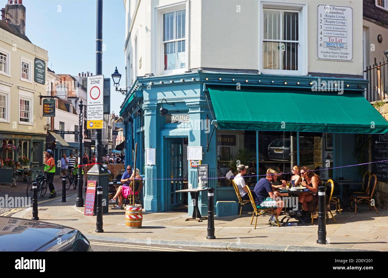 People eating outside at Fagin's restaurant, on the corner of