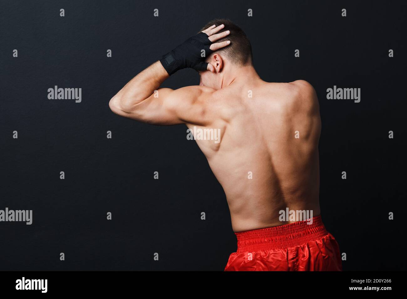 Sportsman muay thai man boxer stance ad elbow punch at black background Stock Photo Alamy