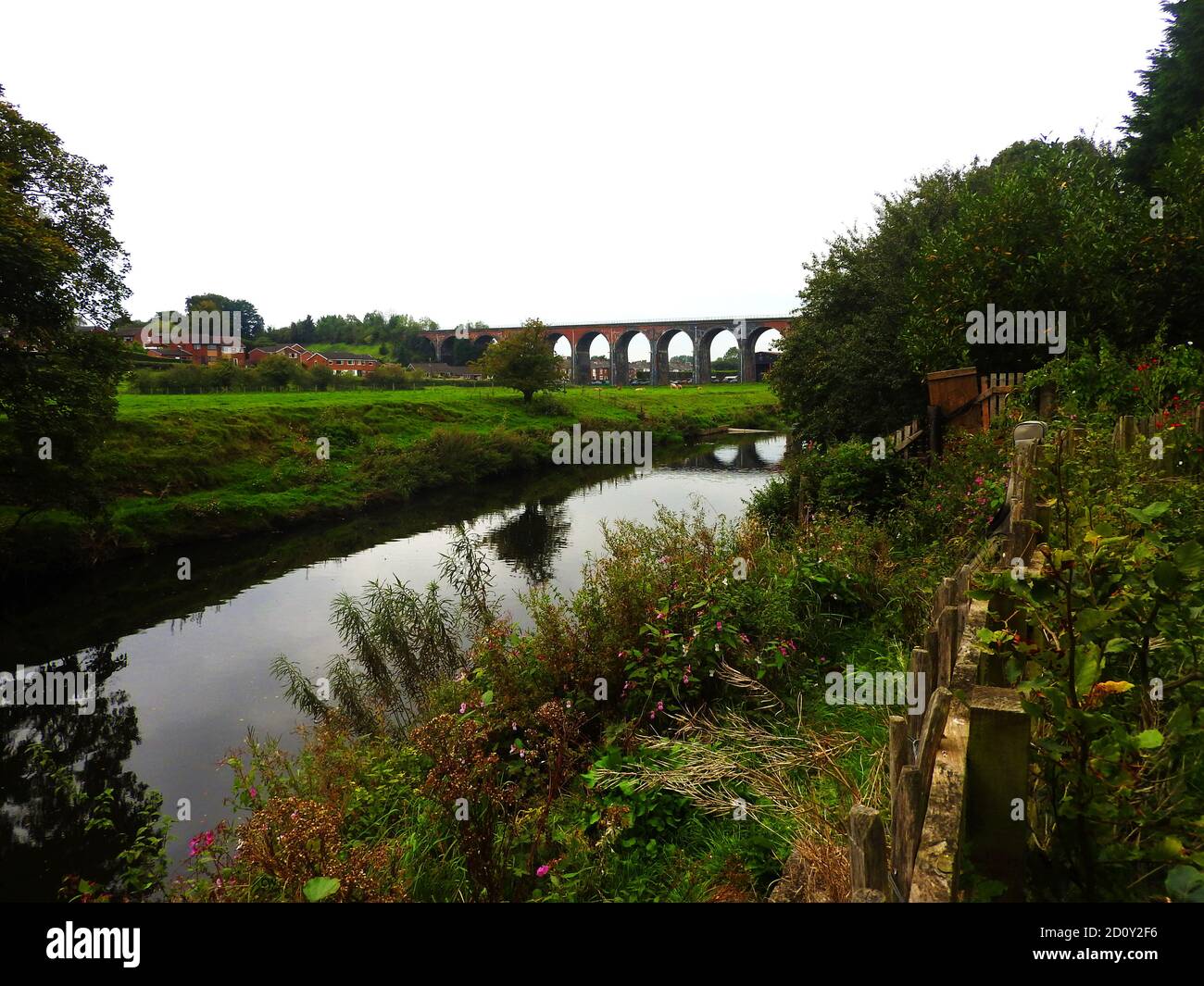 Sept 2000 - The brick built viaduct at Whalley, (known locally as Whalley Arches), Lancashire and the River Calder, England from the grounds of Whalley Abbey . The 48-span railway bridge was built between 1846 and 1850 under the supervision of engineer Terence Wolfe Flanagan and formed part of the Bolton, Blackburn, Clitheroe and West Yorkshire Railway. Over seven million bricks and 12,338 cubic metres of stone were used in its  construction.  In 1849, two of the 41 arches  collapsed. three of those constructing the bridge lost their lives. Stock Photo