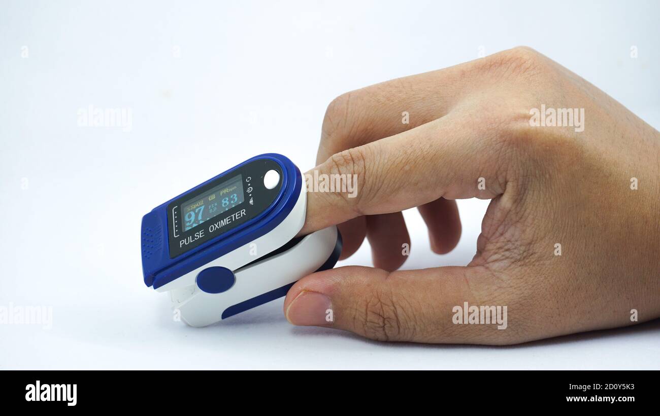 Pulse oximeter used to measure pulse rate and oxygen levels Stock Photo -  Alamy