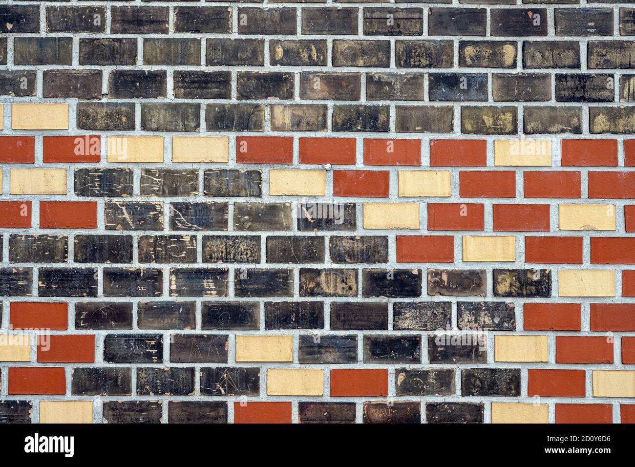 Background from a black, red and beige brick wall Stock Photo