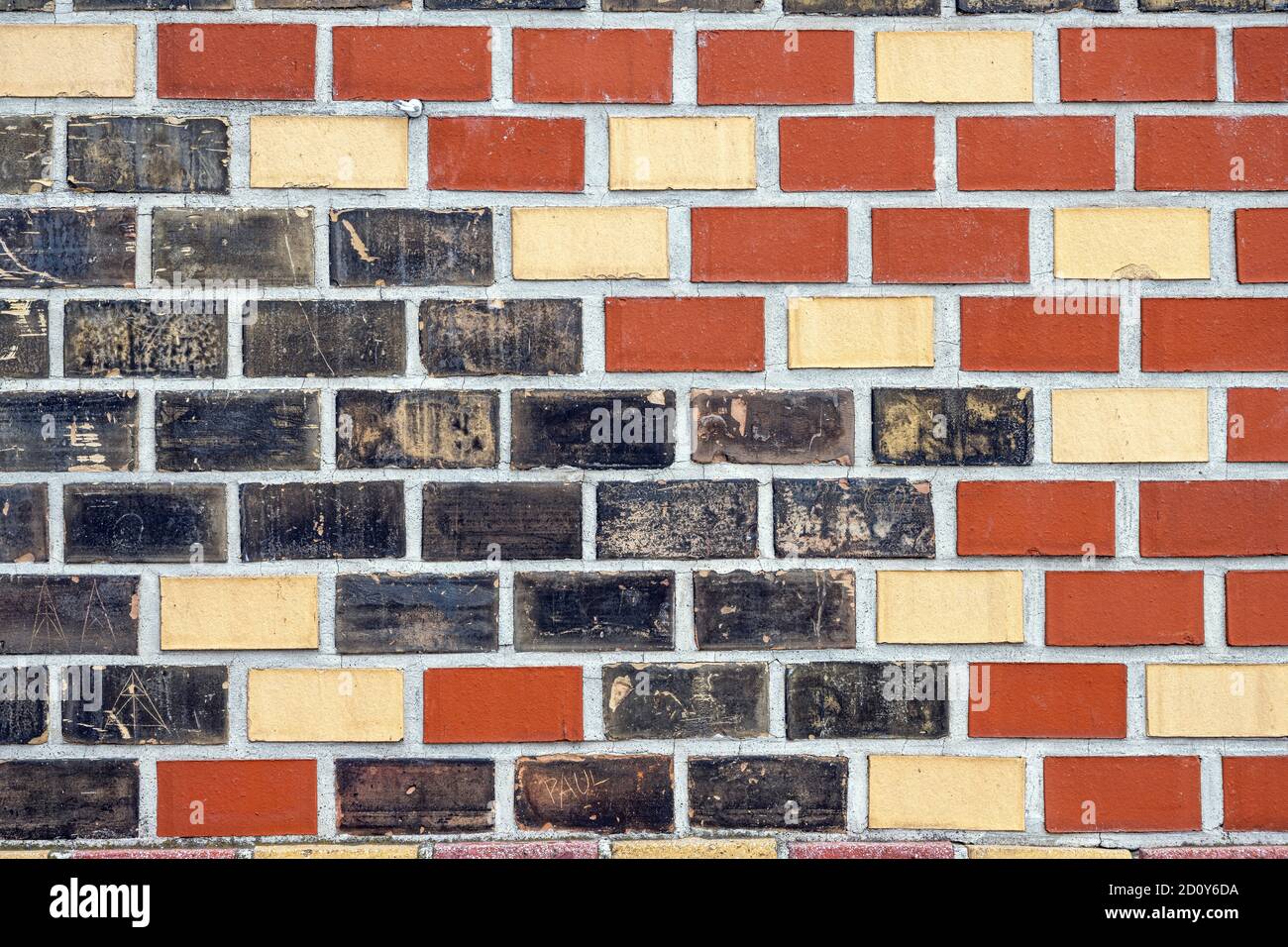 Background from a red, black and beige brick wall Stock Photo