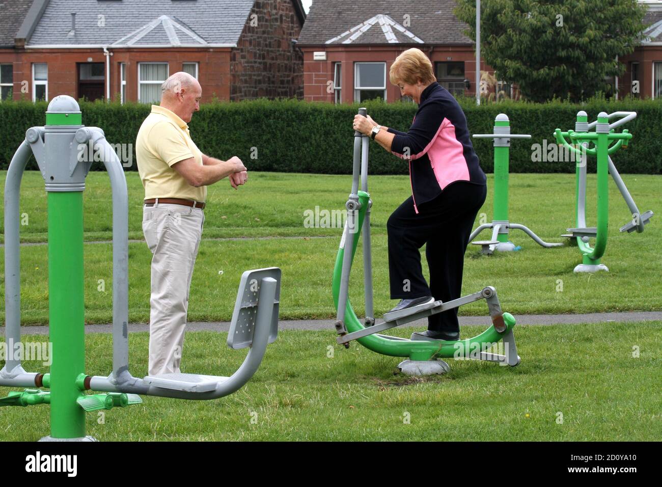 Ayr, Ayrshire, Scotland, 3 Sep 2014 : Retired elderly couple use the exercise equipment at Newton Park, Ayr Stock Photo
